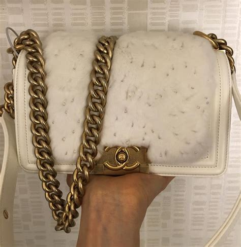 white chanel boy bag with gold hardware|More.